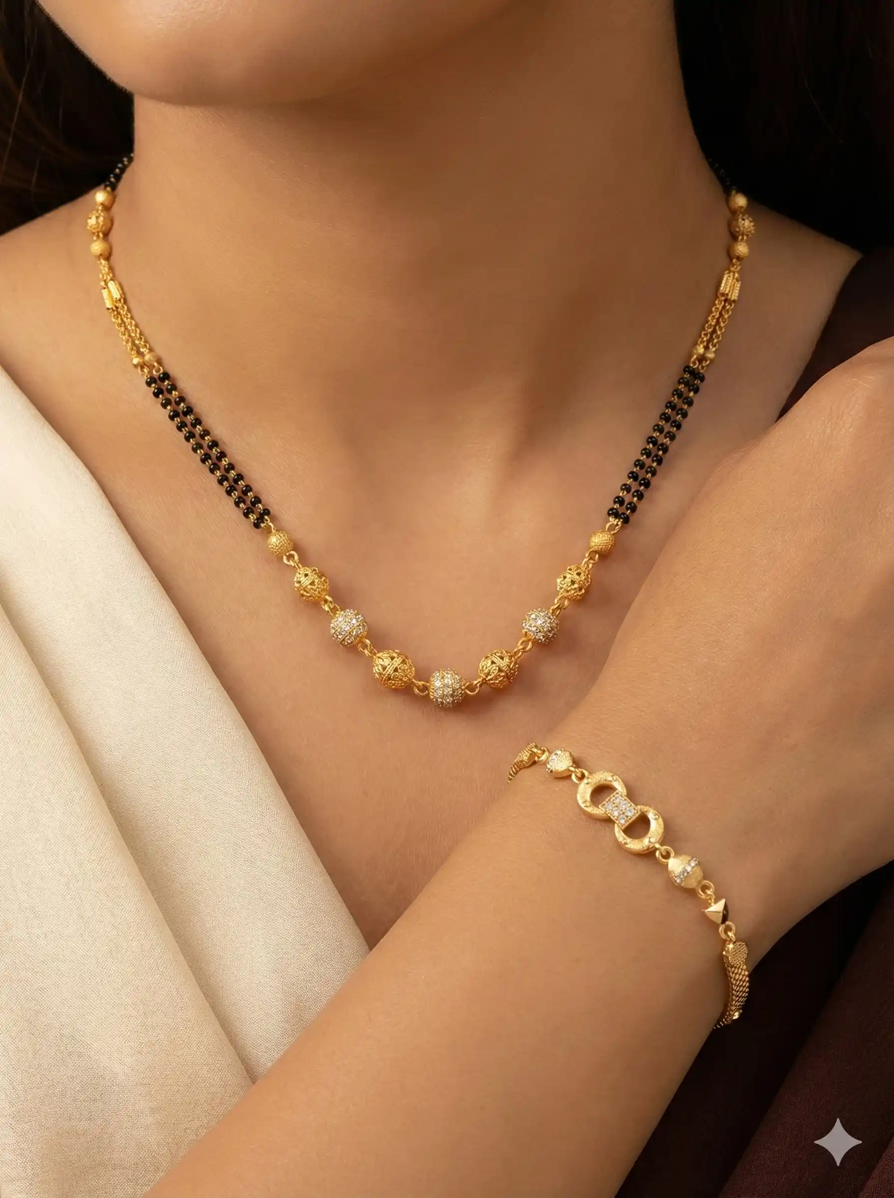 Elegant Dual Line Black Beaded Gold-Plated Mangalsutra with Designer Gold Plated Bracelet.png