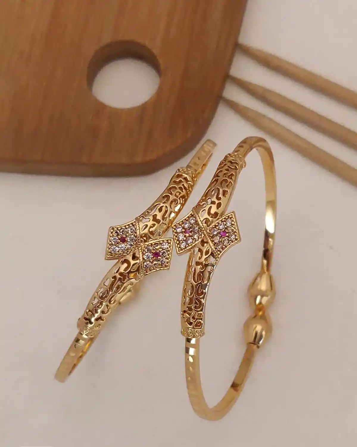 a stunning high gold plated ad diamond trinagle shape adjustble bangle for women.png