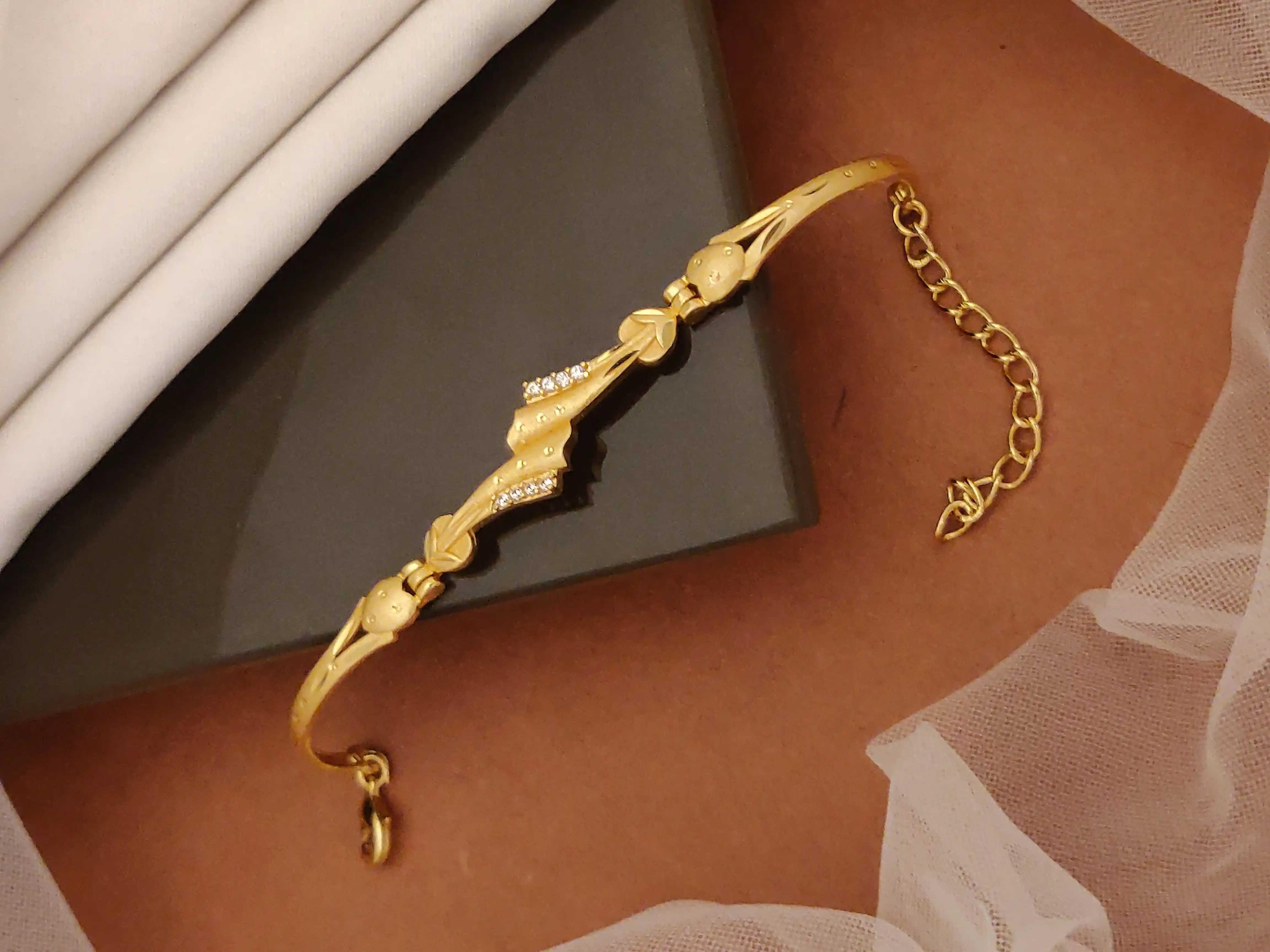 Gold Plated And Diamond Studded Fancy Forming Bracelet.png