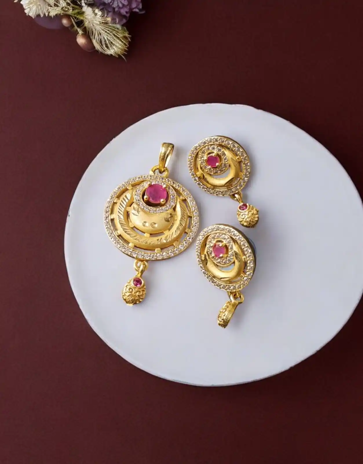 High Gold Plated Stunning American Diamond And Pink Diamond Studded Forming Designer Round Shape Pendent Set.png
