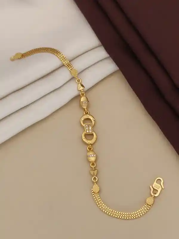 designer gold plated ad diamond studed forming bracelet.png