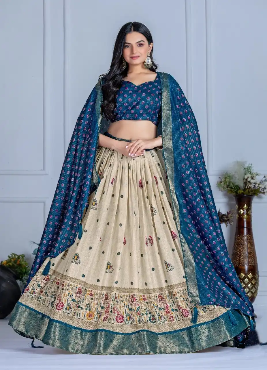 Cream And Blue Heavy Lichi Fabric And Jacquard Silk Patola Print Lehenga Choli For Women.png