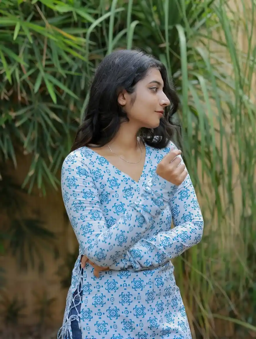 Dusky white with bluebird blue printed swiss cotton.png