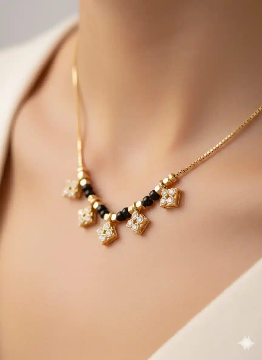 Elegant Gold-Tone Daily Wear short Mangalsutra with Black Beads & Diamond-Style Charms.png