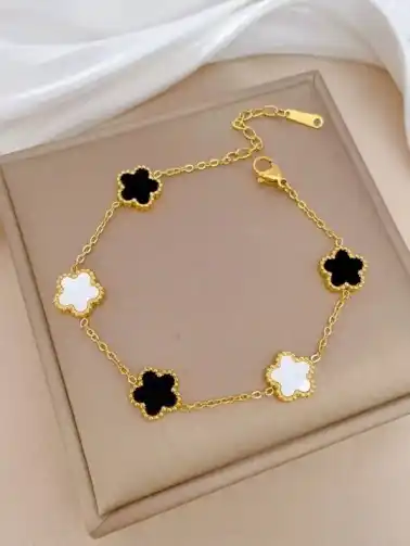 Gold plated white and black reversible  unisex clover bracelet.png