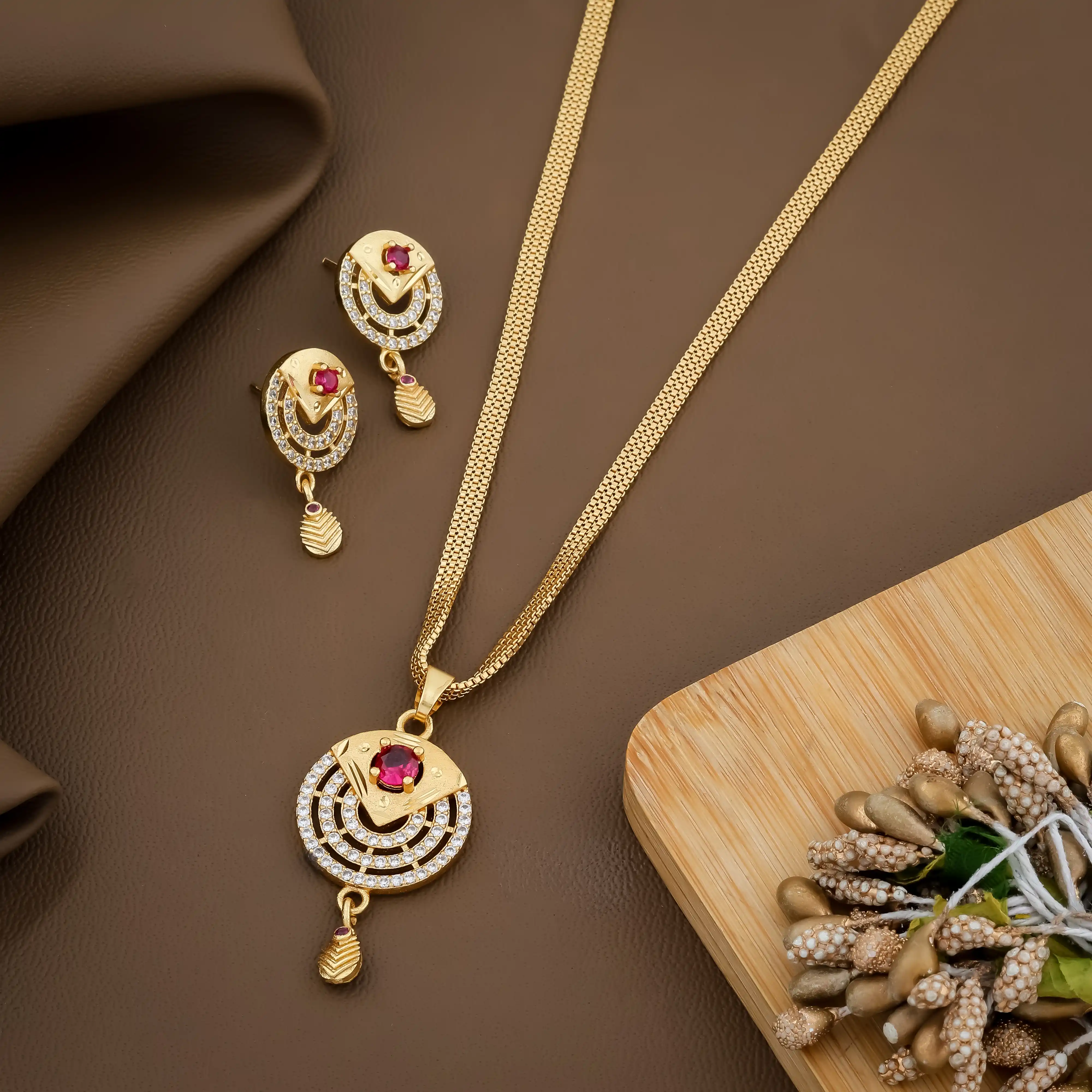 Gold-Toned Cz Stone Studded Pendant Set With Earrings.png