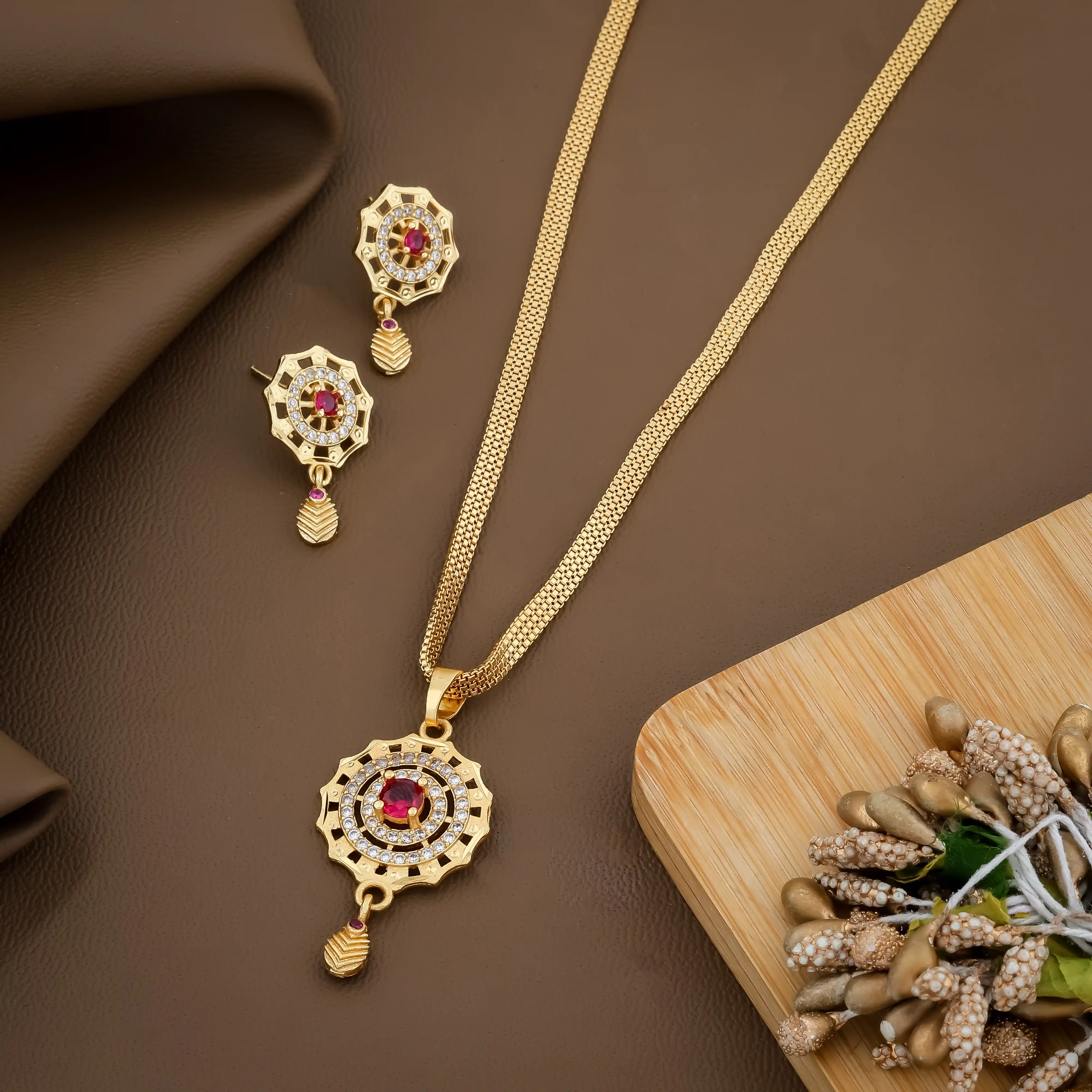 Traditional Gold-Toned Pendant Set With Pink Stone.png